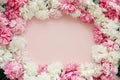 Stylish peonies flat lay. Pink and white peonies frame on pastel pink paper with space for text. Happy mothers day greeting card Royalty Free Stock Photo