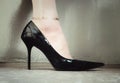 Stylish photo with woman elegant leg in black shoes on high heels. Royalty Free Stock Photo