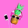 Stylish pineapple sunglasses and headphones listens to music