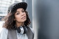 Stylish pleasant teenager is spending time outdoors