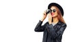 Stylish portrait of beautiful young woman photographer taking picture with film camera wearing black round hat, leather jacket Royalty Free Stock Photo