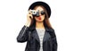 Stylish portrait of beautiful young woman photographer with vintage film camera wearing black round hat, leather jacket isolated Royalty Free Stock Photo