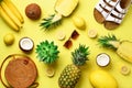 Stylish rattan bag, coconut, birkenstocks, succulent, sunglasses and yellow fruits on sunny background. Banner. Top view