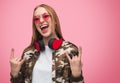 Stylish rebel woman in sunglasses and headphones Royalty Free Stock Photo