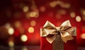 Stylish red christmas gift with golden ribbon and bow against bokeh lights background copy space Merry Christmas,festive Royalty Free Stock Photo