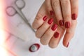 Stylish red female nails. Modern Beautiful manicure. Autumn winter nail design concept of beauty treatment. Gel nails Royalty Free Stock Photo