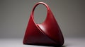 Stylish Red Leather Bag With Curvilinear Triangle Design
