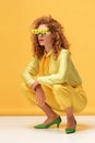 Stylish redhead woman in sunglasses with