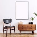 Stylish and retro living room with design vintage wooden commode, chair and elegant personal accessories. Mock up poster.