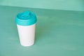 Stylish reusable eco-friendly bamboo cup on mint green background Royalty Free Stock Photo