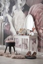 Room interior with elegant dressing table and floral wallpaper
