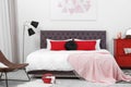 Stylish room interior with large bed Royalty Free Stock Photo
