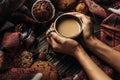 Stylish rustic winter picture with hands holding warm coffee coo Royalty Free Stock Photo