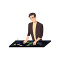 Stylish satisfied smiling disk jockey mixing tracks, holding hand on vinyl record and turntable needle on white