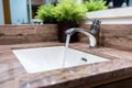 A stylish Scandinavian bathroom with a modern washbasin