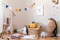 Beige playroom for kids in cute Scandinavian style.