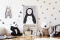 Stylish scandinavian kid room with mock up poster, toys, teddy bear, plush animal, natural pouf and children accessories. Modern