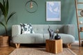 Stylish, Scandinavian living room with mint sofa. Royalty Free Stock Photo