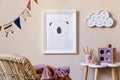 Playroom for kids with cute toys and mockup poster frame in Scandinavian style