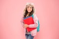 Stylish schoolgirl. Academic term. Winter semester. Teen with backpack and books. Girl little fashionable schoolgirl