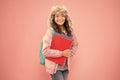 Stylish schoolgirl. Academic term. Winter semester. Teen with backpack and books. Girl little fashionable schoolgirl