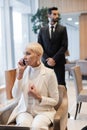 stylish senior businesswoman talking on smartphone