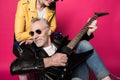 Stylish senior couple having fun together with electric guitar Royalty Free Stock Photo