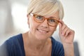 Stylish senior woman wearing trendy eyeglasses Royalty Free Stock Photo