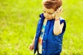 Stylish serious baby boy with ginger (red) using smartphone Royalty Free Stock Photo