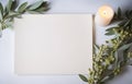 Stylish setting wedding table with place card with olive branch and eucalyptus leaves on white tablecloth Royalty Free Stock Photo