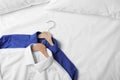 Stylish shirts on bed. Dry-cleaning service Royalty Free Stock Photo