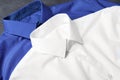 Stylish shirts on grey table, closeup. Dry-cleaning service Royalty Free Stock Photo