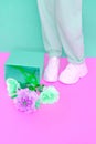 Stylish shoes and roses. White Sneakers. Minimal Pastel Summer mood concept. Ideal for bloggers, websites, magazines, business Royalty Free Stock Photo