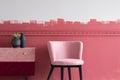 Small pastel pink chair next to trendy pink and burgundy commode
