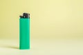 Stylish small pocket lighter on beige background, space for text Royalty Free Stock Photo