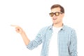 Stylish smiling guy. Cheerful young handsome man in sunglasses and looking away with smile. Copy space. Mock up. Summer fun Royalty Free Stock Photo