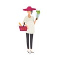 Stylish smiling pregnant woman wearing hat and carrying shopping basket with healthy food and wholesome products