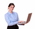 Stylish smiling young woman using a laptop Royalty Free Stock Photo