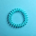 Stylish spiral rubber band on background, top view Royalty Free Stock Photo