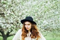 Stylish spring bohemian outfits. Wearing a white sweater and bla