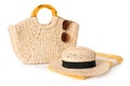 Stylish straw hat, beach bag, towel and sunglasses on white background Royalty Free Stock Photo