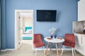Stylish studio apartment interior with comfortable beige sofa Royalty Free Stock Photo