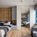 Stylish studio apartment with wood decor