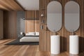 Stylish studio interior with two washbasins and sleeping zone