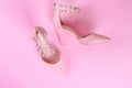 Stylish summer sandals of pastel color isolated on pink background, close up. Top view. Flat lay Royalty Free Stock Photo