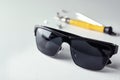 Stylish sunglasses and fixing tools on table Royalty Free Stock Photo
