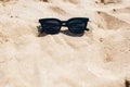 Stylish sunglasses on sandy beach with sea shells. Summer Vacation. Space for text. Hello summer concept, relax and travel. Girl Royalty Free Stock Photo