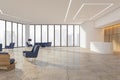 Stylish sunlit spacious waiting area hall in modern business center with city view background from panoramic window, light ceiling Royalty Free Stock Photo