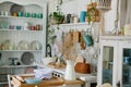 Stylish and sunny interior of kitchen space with small wooden table at the photo studio. Scandinavian room decor with kitchen