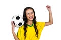 Stylish supporting woman holding football ball rejoicing Royalty Free Stock Photo